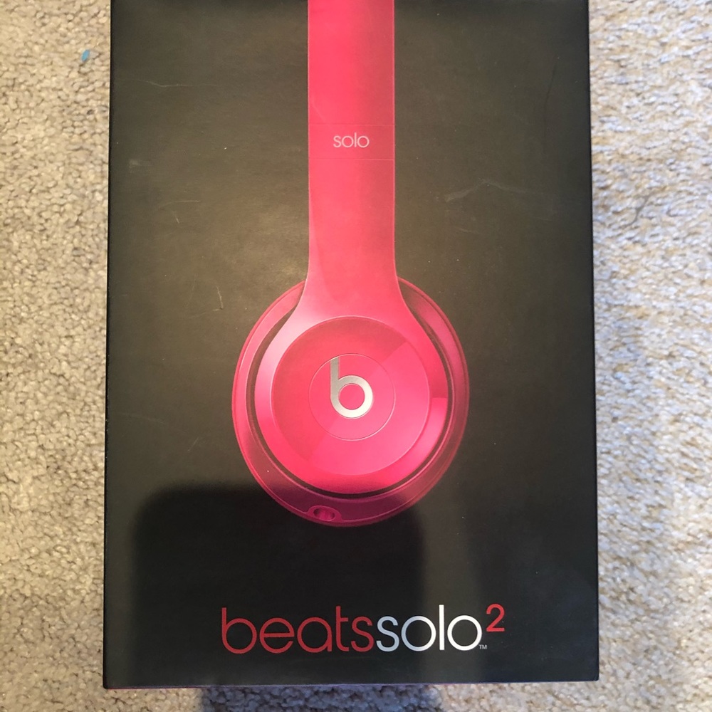 Hot pink Beats headphones